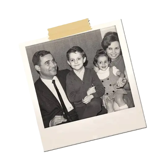 A polaroid photo of a family, capturing a precious lifetime memory